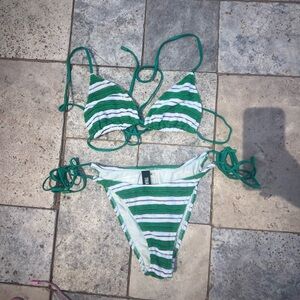 A stripped green Triangl bikini, in great condition, top medium, bottom medium